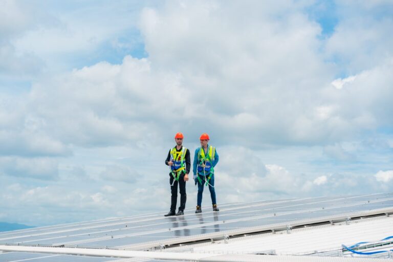 SOLAR INSTALLERS ON COMMERCIAL ROOF